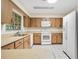 Well-lit kitchen featuring ample cabinetry and a complete appliance package at 36208 Micro Racetrack Rd, Fruitland Park, FL 34731