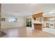 Open floor plan showing living room and partial kitchen view with access to the patio at 36208 Micro Racetrack Rd, Fruitland Park, FL 34731