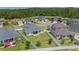 Aerial view with long, fenced backyard with a patio for outdoor activities at 4296 Mirror Ct, Clermont, FL 34714