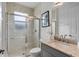 Elegant bathroom featuring a glass-enclosed shower, a toilet, and a stylish vanity at 4296 Mirror Ct, Clermont, FL 34714