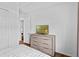 This is a well lit bedroom with a TV at 4296 Mirror Ct, Clermont, FL 34714