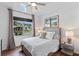 This bedroom features a view of the outdoors and recessed lighting at 4296 Mirror Ct, Clermont, FL 34714
