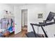 Versatile flex room with a treadmill and closet, ideal for a home gym, office, or hobby space at 4296 Mirror Ct, Clermont, FL 34714