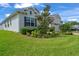 Charming home showcasing lush landscaping, a brick driveway, and an attached two-car garage in a desirable neighborhood at 4296 Mirror Ct, Clermont, FL 34714