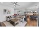 Inviting living area with comfortable seating, hardwood floors, and an open layout, ideal for entertaining guests at 4296 Mirror Ct, Clermont, FL 34714