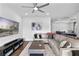 Expansive living area with hardwood floors, a large sectional sofa, and an open layout, perfect for Gathering gatherings at 4296 Mirror Ct, Clermont, FL 34714