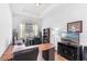 Well-lit home office with a large desk, built-in shelving, and a comfortable workspace for productivity at 4296 Mirror Ct, Clermont, FL 34714