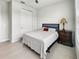 Bright bedroom with a queen bed, ceiling fan, and large window offering natural light at 4336 Foggy Oak Ln, Sanford, FL 32773
