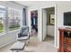 Bedroom boasts a chair and view to the window, with access to closet and bathroom at 4336 Foggy Oak Ln, Sanford, FL 32773