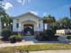 Community clubhouse with a welcoming entrance, landscaped grounds, and pedestrian access at 4336 Foggy Oak Ln, Sanford, FL 32773