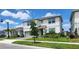 Charming two-story home with a manicured lawn, beautiful landscaping and gray siding at 4336 Foggy Oak Ln, Sanford, FL 32773