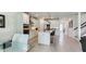 Spacious, modern kitchen features a center island with bar seating, stainless steel appliances, and ample cabinetry at 4336 Foggy Oak Ln, Sanford, FL 32773