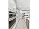 Modern kitchen featuring stainless steel appliances, sleek cabinetry, and quartz countertops for a contemporary design at 4336 Foggy Oak Ln, Sanford, FL 32773