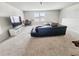 Comfortable living room features a spacious seating area, entertainment center, and ample natural light at 4336 Foggy Oak Ln, Sanford, FL 32773