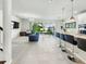 Open-concept living room with kitchen island and access to backyard patio at 4336 Foggy Oak Ln, Sanford, FL 32773