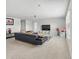Spacious living room offers a comfortable seating area with a plush sofa and a modern entertainment center at 4336 Foggy Oak Ln, Sanford, FL 32773