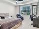 This main bedroom features a ceiling fan, window, workspace, and a comfortable reading chair at 4336 Foggy Oak Ln, Sanford, FL 32773