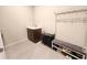 Mud room with storage bench and shoe rack, utility sink, and coat rack for organization at 4336 Foggy Oak Ln, Sanford, FL 32773