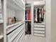 A walk-in closet features custom shelving and hanging racks to maximize storage space at 4336 Foggy Oak Ln, Sanford, FL 32773