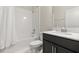 Bathroom featuring a shower-tub combination, a white vanity, a dark wood cabinets, and white tile floor at 4350 Verde Valley Ln, Kissimmee, FL 34746