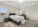 Bedroom with a large window overlooking the lake, a bed, and a dresser with a mirror at 4350 Verde Valley Ln, Kissimmee, FL 34746