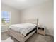 Cozy bedroom with a large window for natural light, a comfortable bed, and soft carpeting throughout at 4350 Verde Valley Ln, Kissimmee, FL 34746