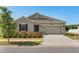 Charming single-Gathering home with a well-maintained lawn, a two-car garage, and a welcoming front entrance at 4350 Verde Valley Ln, Kissimmee, FL 34746