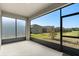 Screened lanai provides an open view of the fenced backyard and landscaping at 4350 Verde Valley Ln, Kissimmee, FL 34746