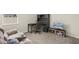 Comfortable living area with a desk, chair, TV, and a cozy couch, perfect for relaxation and productivity at 4350 Verde Valley Ln, Kissimmee, FL 34746