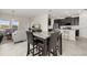 Open-concept living space with kitchen, living room, and dining area, perfect for entertaining and Gathering gatherings at 4350 Verde Valley Ln, Kissimmee, FL 34746