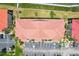 Aerial view of condo building with terracotta roof surrounded by parking at 446 Bouchelle Dr # 103, New Smyrna Beach, FL 32169