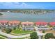 Bayfront condos boast red tile roofs, private parking, landscaped grounds, and stunning water views for upscale living at 446 Bouchelle Dr # 103, New Smyrna Beach, FL 32169