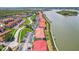 Waterfront condos feature red tile roofs, bayside docks, landscaping, and a convenient parking area for residents and guests at 446 Bouchelle Dr # 103, New Smyrna Beach, FL 32169