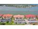 Aerial view of waterfront condos with parking at 446 Bouchelle Dr # 103, New Smyrna Beach, FL 32169