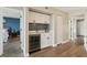Charming bar area with wine cooler, white cabinets, and blue backsplash at 446 Bouchelle Dr # 103, New Smyrna Beach, FL 32169