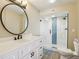 Updated bathroom with modern vanity, framed mirror, and glass shower at 446 Bouchelle Dr # 103, New Smyrna Beach, FL 32169