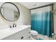 Bathroom featuring a toilet, shower, and granite vanity with a framed mirror at 446 Bouchelle Dr # 103, New Smyrna Beach, FL 32169
