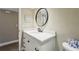 Bathroom featuring an updated granite vanity and a framed mirror at 446 Bouchelle Dr # 103, New Smyrna Beach, FL 32169