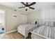 A guest bedroom featuring two twin beds and a closet for storage at 446 Bouchelle Dr # 103, New Smyrna Beach, FL 32169
