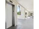 Hallway view of ground floor elevator access at 446 Bouchelle Dr # 103, New Smyrna Beach, FL 32169