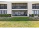Screened lanais and balconies on a three-story condominium building at 446 Bouchelle Dr # 103, New Smyrna Beach, FL 32169