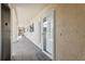 Hallway view of ground floor condo entrances with elevator access at 446 Bouchelle Dr # 103, New Smyrna Beach, FL 32169