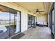 Screened-in lanai with views of the waterfront at 446 Bouchelle Dr # 103, New Smyrna Beach, FL 32169