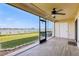 Screened-in lanai with peaceful views of the water at 446 Bouchelle Dr # 103, New Smyrna Beach, FL 32169