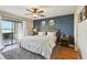 Comfortable bedroom with sliding glass doors and water view at 446 Bouchelle Dr # 103, New Smyrna Beach, FL 32169