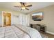 Comfortable main bedroom featuring an entertainment center and an en suite bathroom with updated finishes at 446 Bouchelle Dr # 103, New Smyrna Beach, FL 32169