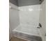 Clean, white tiled shower and tub combination in bathroom at 4772 Walden Cir # 228, Orlando, FL 32811