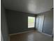 Cozy bedroom with a window overlooking the neighborhood at 4772 Walden Cir # 228, Orlando, FL 32811