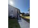 Low angle shows building exterior and access stairs to 2nd floor units at 4772 Walden Cir # 228, Orlando, FL 32811