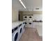 Laundry room with modern washers and dryers for residents at 4772 Walden Cir # 228, Orlando, FL 32811